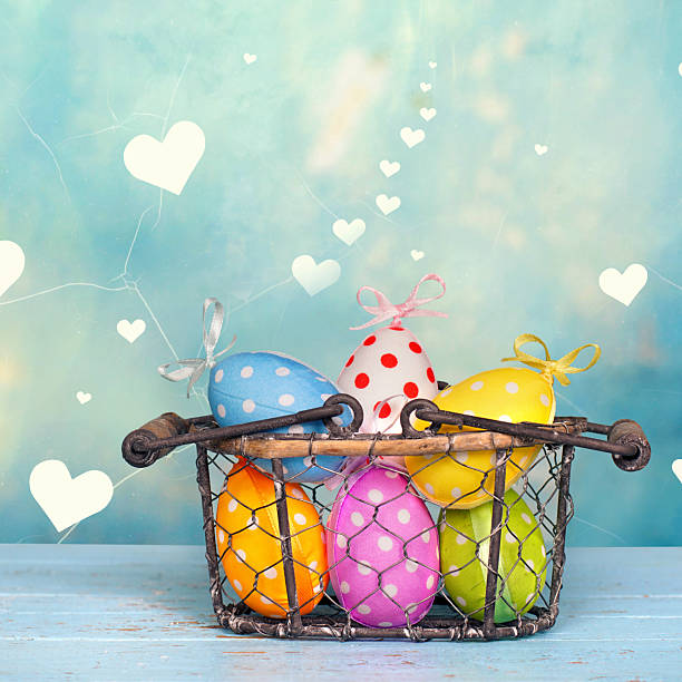 istock beautiful easter eggs in a vintage basket against lovely heart background 2207203719