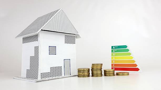 istock Close up of a small model house with energy class consumption idea 2207203876