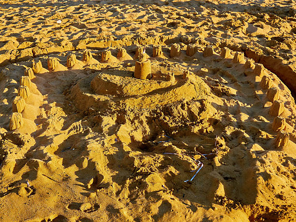 istock Sandcastle on the beach in the evening 2207208137