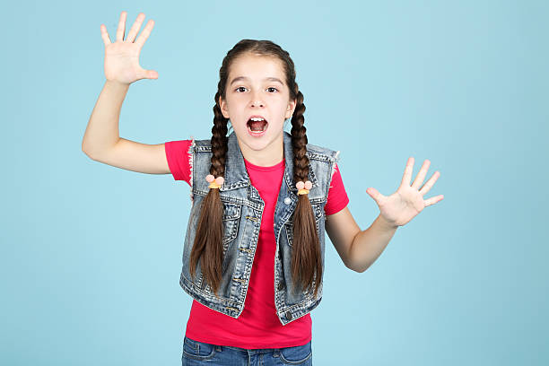 istock Beautiful young girl on blue background 2207210530
