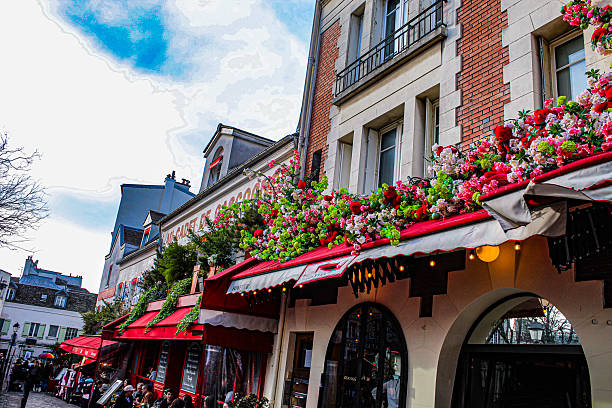 View of traditional Parisian architecture with a red rooftop and cityscape in the background during winter.\n\nMontmartre, Paris, France