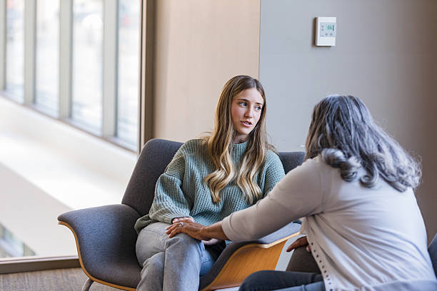 istock Woman Receiving Emotional Support, Group Therapy Session 2207211242