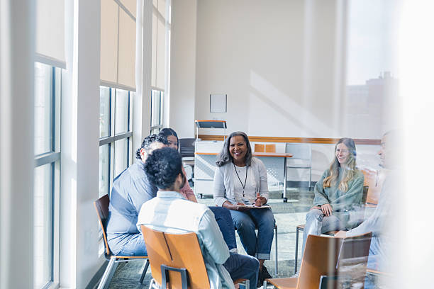 istock Group Therapy Session: Diverse Adults Discussing Mental Health 2207211244