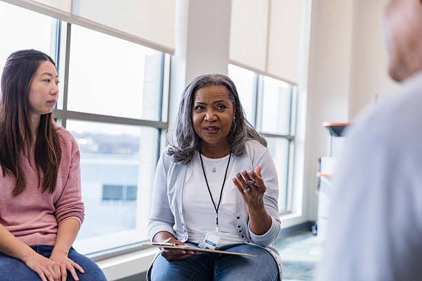 istock Group therapy session: Diverse women discussing mental health 2207211268