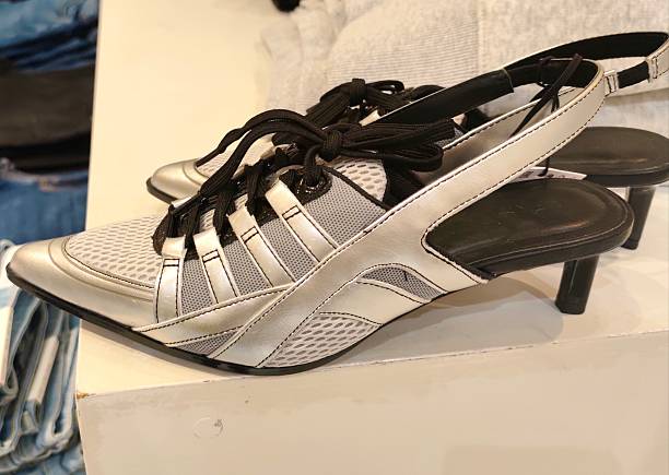 istock Silver high heels with shoelaces 2207211420