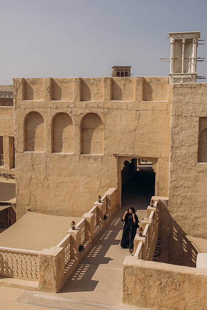 istock Traditional Middle Eastern Architecture with Woman Walking in Courtyard 2207213847
