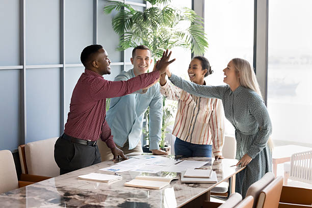 istock Cheerful successful multiethnic business team giving group high five 2207215209