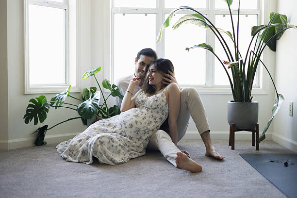 istock 8 Months Pregnant - Middle Eastern Tunisian Couple - Cuddling 2207219942