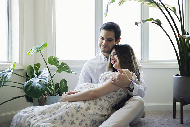 istock 8 Months Pregnant - Middle Eastern Tunisian Couple - Cuddling 2207220014