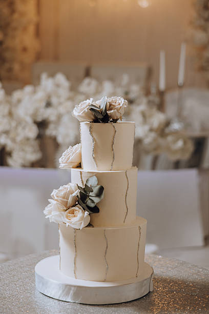 istock A three tier wedding cake with flowers on top 2207221229