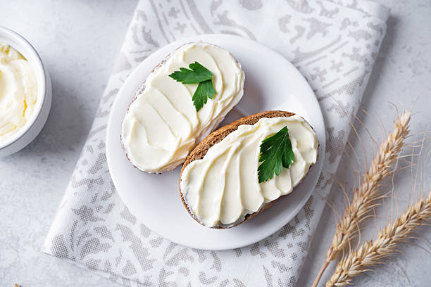 istock Rye buns with butter topping in a plate 2207224096