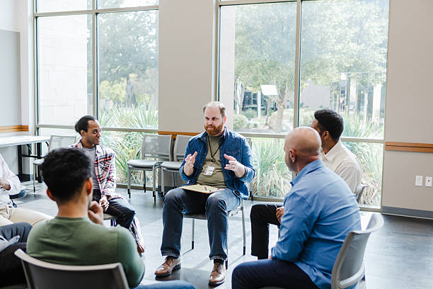 istock Group therapy session with a mental health professional 2207226415