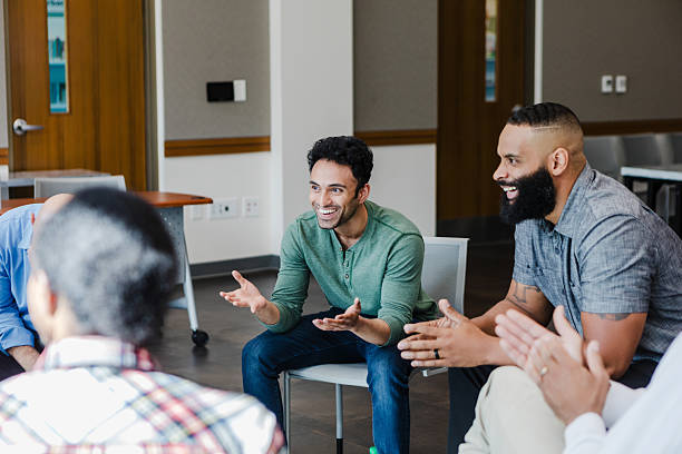 istock Group Therapy Session: Diverse Adults Discussing Mental Wellbeing 2207226429