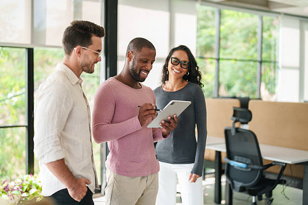 istock Business Leaders Collaborating in Bright Modern Office 2207229825