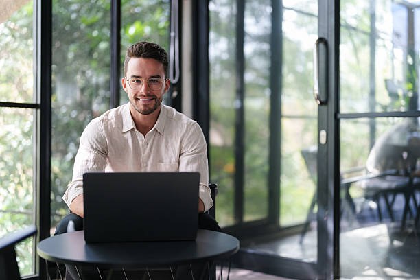 istock Young Professional Working In Modern Glass Office Space 2207229834