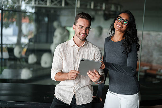 istock Confident Business Professionals Discuss Strategy in Modern Office 2207229930