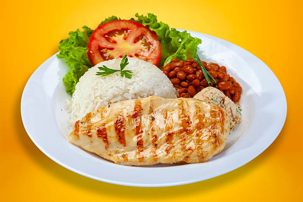 istock Rice beans grilled chicken steak salad and farofa 2207230263