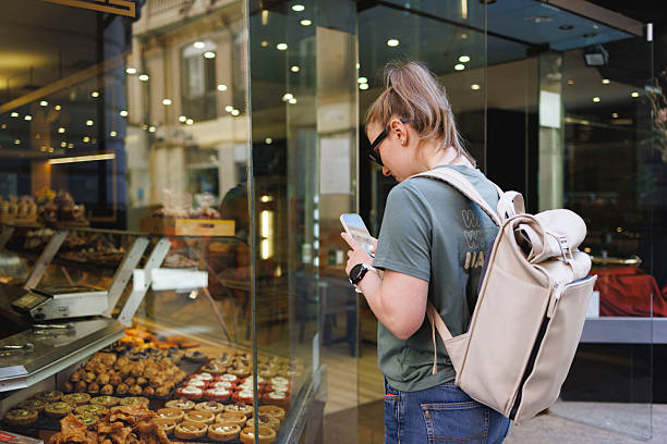 istock Student eating local cuisine while exploring the new city. 2207231936