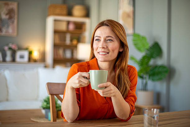 istock Woman enjoying coffee at home 2207236938