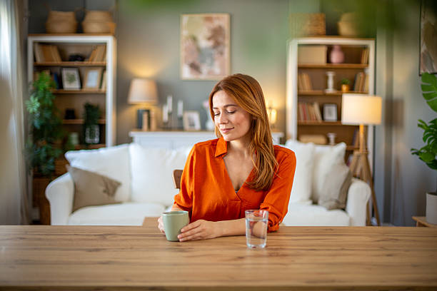 istock Woman enjoying coffee at home 2207237040