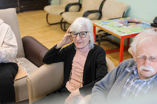 istock Therapist Leading a Group Session in a Nursing Home (80+) 2207240051