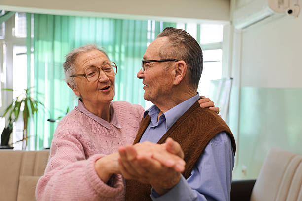 istock Elderly Couple (80+) Dancing in a Nursing Home 2207240298