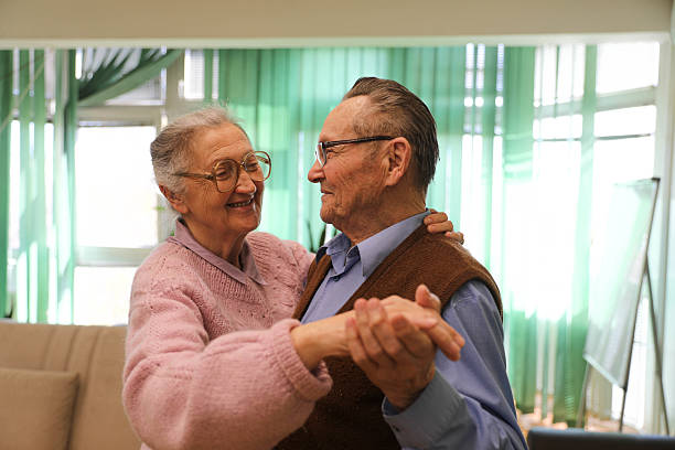 istock Elderly Couple (80+) Dancing in a Nursing Home 2207240446