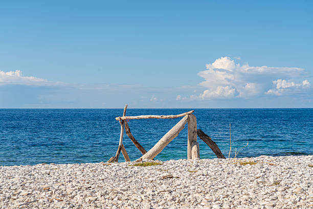 Simple wood structure on a beach against blue sea and sky, Dugi otok island, Croatia