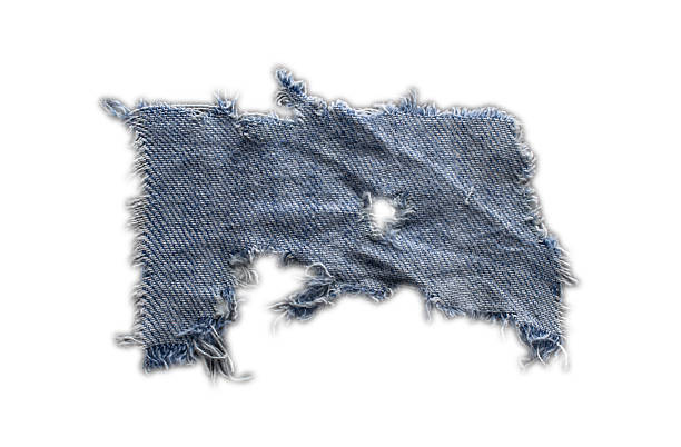 istock jeans. a frayed and torn piece of denim rag 2207242108