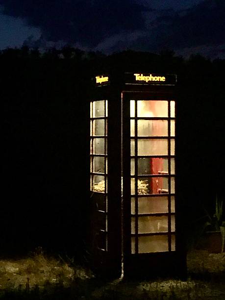 istock Classic red BT telephone box at night 2207243248