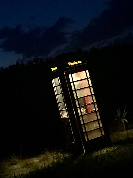 istock Classic red BT telephone box at night 2207243266