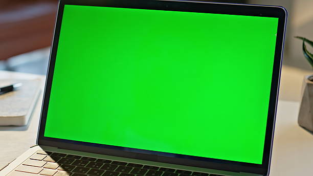 istock Modern green screen laptop computer placed on desk closeup. Mockup display pc 2207244379