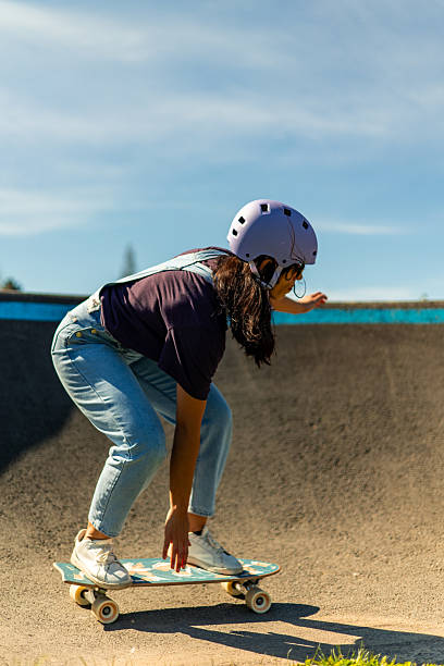 istock Young latin woman practicing surfskate in a pump track 2207244421