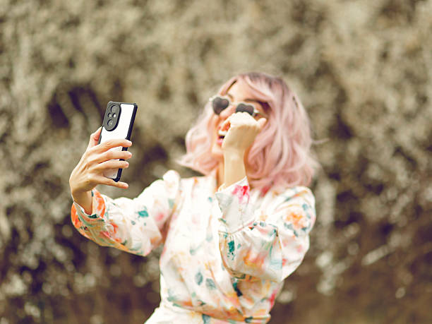 istock Spring portrait of a beautiful woman using phone 2207245782