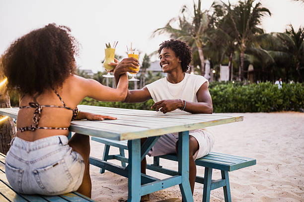 istock Young Black Couple Celebrating Together at the beach 2207248227
