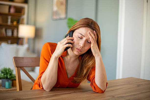 istock Displeased businesswoman talking on the phone having problems 2207250005