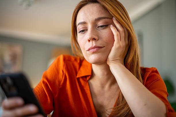 istock Woman waiting message on the phone 2207250041