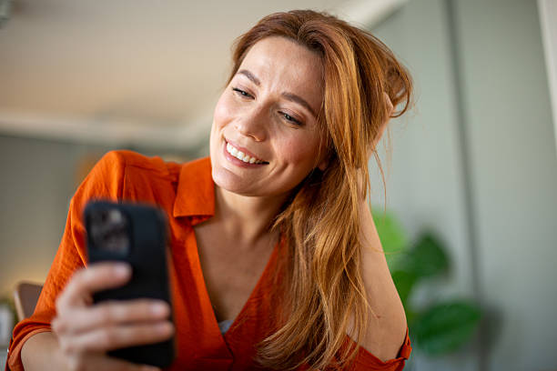 istock Happy woman receiving love message 2207250131