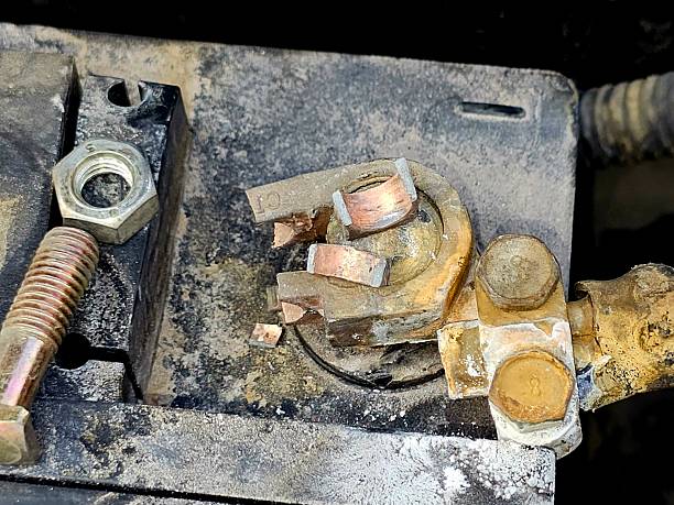 istock Cairo, Egypt, March 13 2025: broken battery terminal, rusty broken car electrical contact to a vehicle battery with lots of rust on it 2207250256