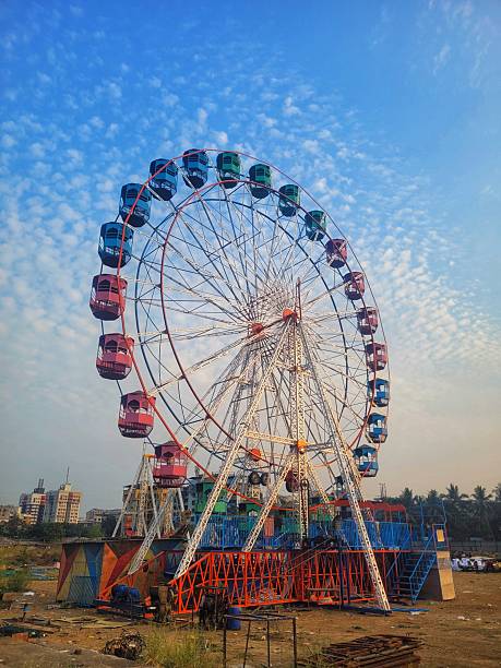 istock Ferris Wheel Against Cloudy Sky During Daytime 2207252320