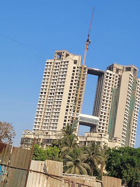 istock Low angle view of skyscraper against blue sky 2207252739