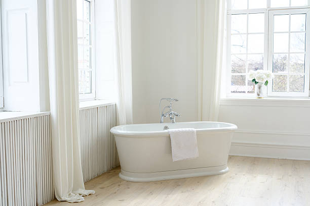 istock Freestanding White Bathtub in Elegant Interior 2207255588