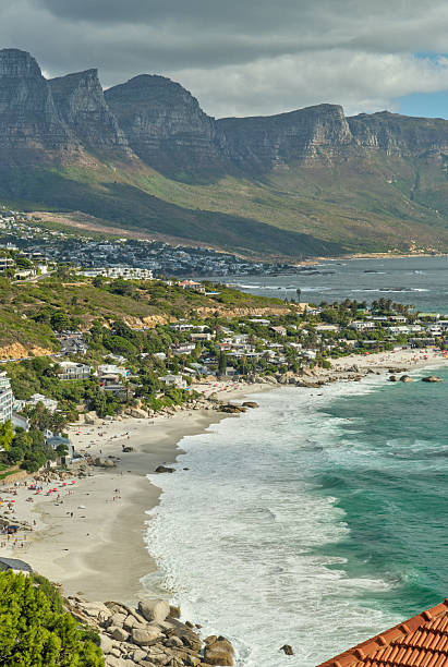 istock Scenic Coastal Landscape Featuring a Serene Beach and Towering Mountains 2207255720