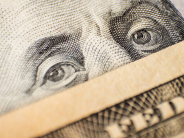 istock Eyes on dollar bill as an idea for protective face mask 2207257258