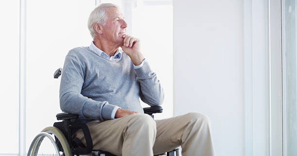 istock Thinking, wheelchair or elderly man at window in home for reflection, idea or hope for rehabilitation. Retirement, vision or senior person with disability, view or remember past memory with nostalgia 2207265532