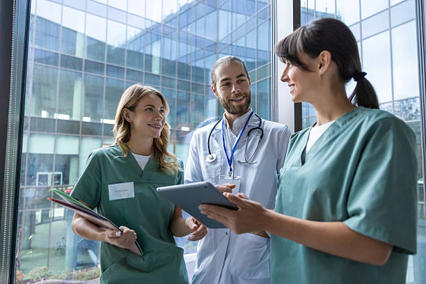istock Team of young doctors discussing something and looking interested and involved 2207267168
