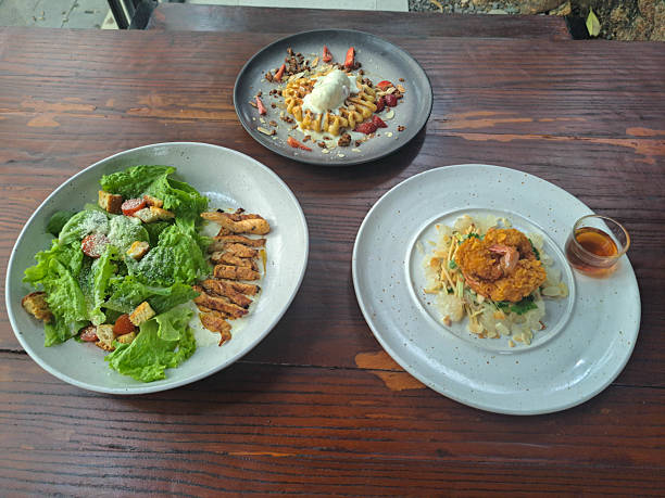 Chicken Gladiator Salad With Mix Salad Served, Roasted Chicken, Tomato Cherry, Croutons, Dressing. Yum Som O Or Thai Pomelo Salad With Mango, Cucumber, Pomelo, Breaded Shrimp Served With Som O Dressing. Waffle With Ice Cream, Granola, Strawberry, Almond.