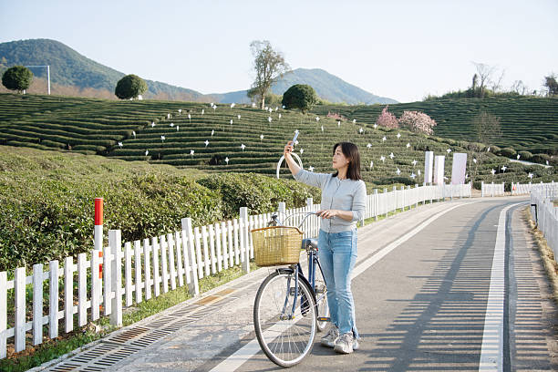 istock asian female selfie with smart phone 2207273134