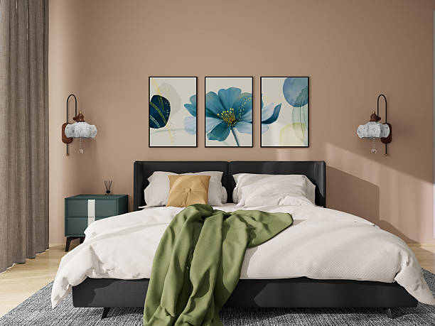 istock Luxurious apartment background with contemporary design. Modern interior design showcasing a cozy bed adorned with pillows and a blanket, a bedside table with a lamp, elegant artwork. 2207280042
