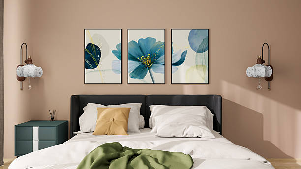 Luxurious apartment background with contemporary design. Modern interior design showcasing a cozy bed adorned with pillows and a blanket, a bedside table with a lamp, elegant artwork.